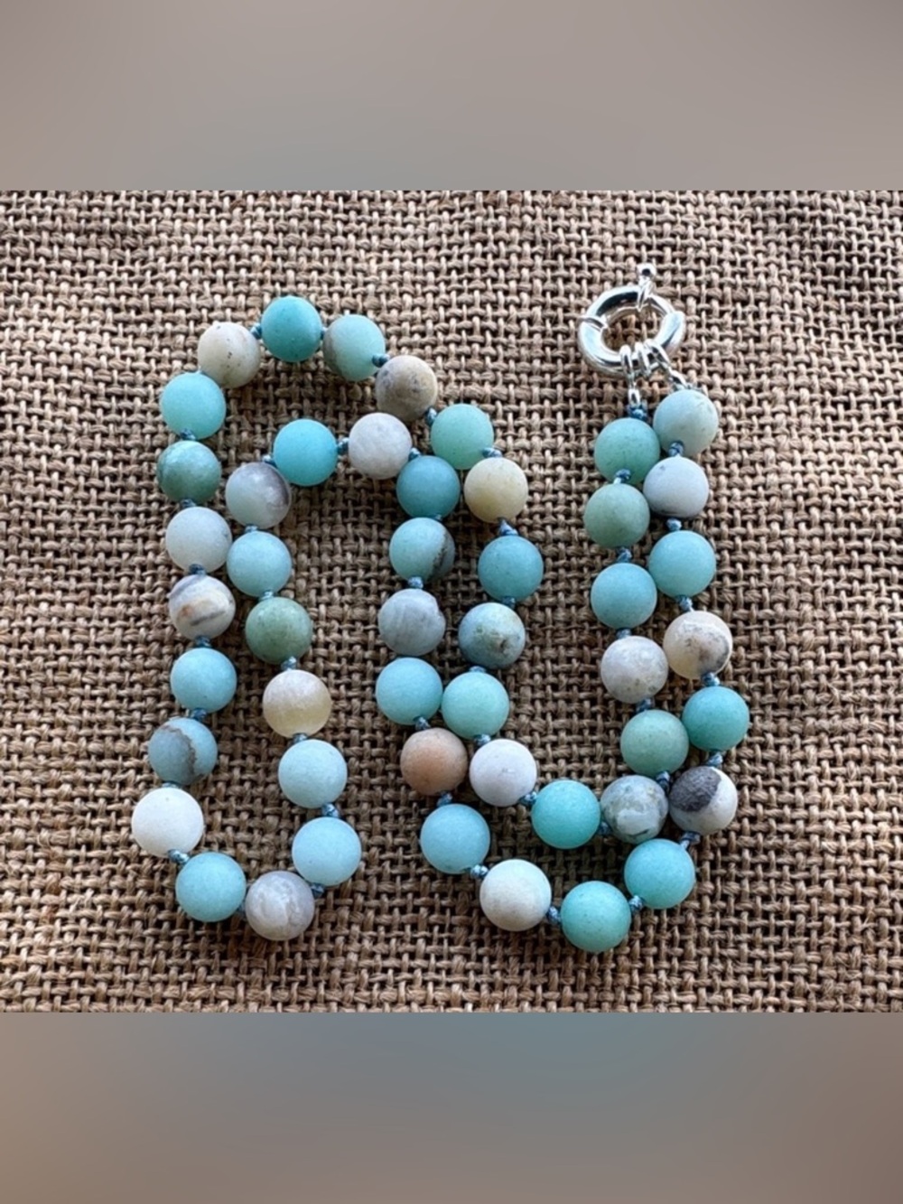 Amazonite necklace features hand-knotted gemstone beads with a matte finish